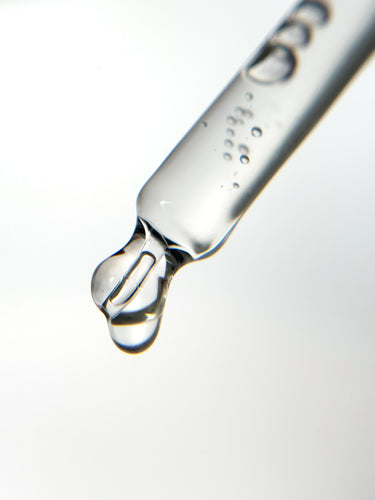 A skincare serum dropper filled with translucent liquid — representing the ingredient-level clarity explored in skincare formulation guides.
