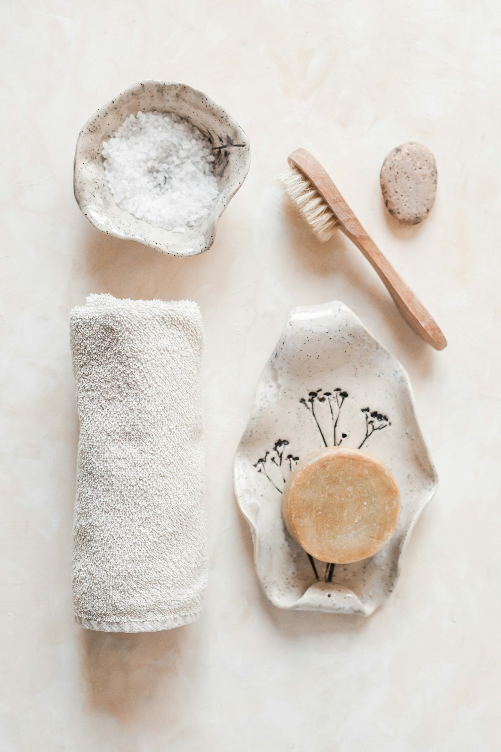 A curated collection of skincare tools invites closer inspection — styled with softness but ready for critique, mirroring the article’s ask: do these rituals really work?