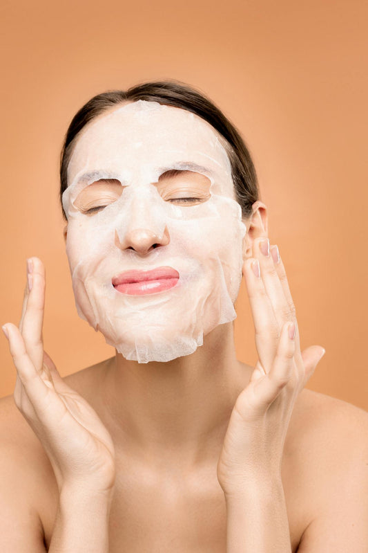A woman in the middle of her skincare cycle, smiling with a foaming cleanser on her face — visualizing the joy and routine of a 24-hour skincare ritual.